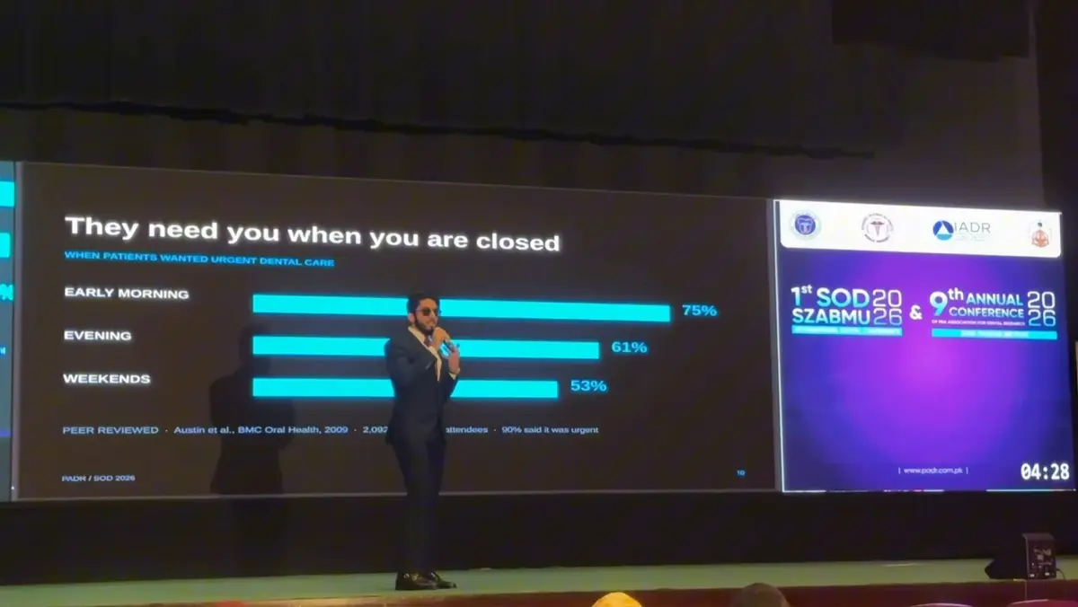 The out-of-hours patient demand slide, with peer-reviewed figures, on the conference screen.