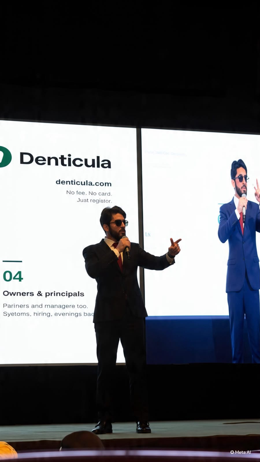 On stage, presenting the business of dentistry to a seated room.